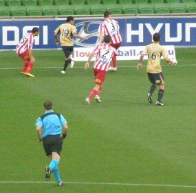 The ball eludes three Heart players and two Jets. Photo: Roy Hay.